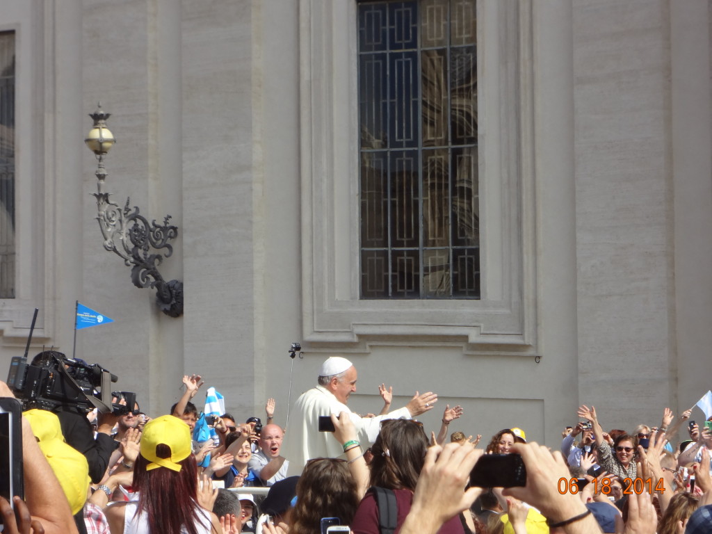 The Pope rides around the crowd in a sort of popemobile and greets all the attendees.  I saw people reaching out to touch him, one pilgrim even gave the Pope his baby, which he gently kissed on the head.  You can feel the excitement within the crowds.